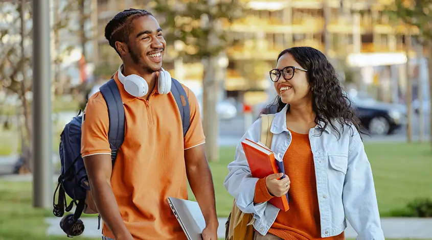 two young adults walking to class